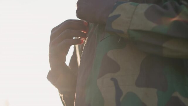 Camouflaged Soldier At Dawn, Cinematic Scene Of Soldier In Camouflage At Sunrise With Warm Lighting, Detailed Shot Of Tactical Soldier In Camo During Sunrise With Warm Glow And Lens Flare