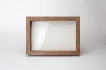 Wooden desktop photo frame modern style, picture frame on white background.