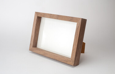 Wooden desktop photo frame modern style, picture frame on white background.
