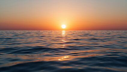 Obraz premium Breathtaking close up of the sun setting over the deep blue ocean water creating a golden reflection