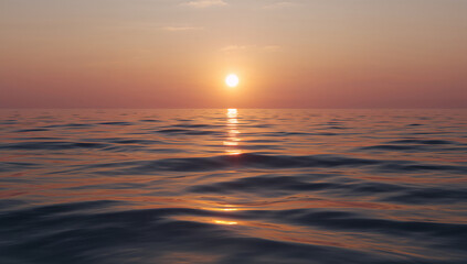 Fototapeta premium Serene ocean surface under a soft orange sunset with gentle waves reflecting golden light across the water