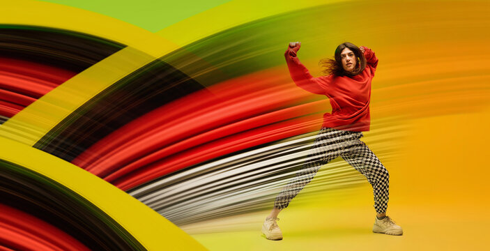 Bold poster of urban dancer breaking through colorful motion curves. Concept of streetwear ads, dance event promo, youth culture marketing, lifestyle brand campaigns, and social media visuals.