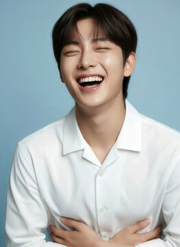 Versatile Visuals: Handsome Young Korean Man with K-pop Idol Looks Posing Against a Light Blue Background