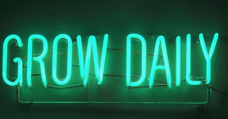 Obraz premium Bright neon sign displays text GROW DAILY. Green illumination contrasts dark background. Simple, motivational message.