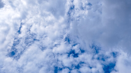Dynamic Cloudscape on a Bright Blue Sky