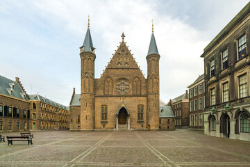 View of the grand Ridderzaal castle with its spires reaching to the sky, standing proudly in the center of the courtyard, Binnenhof, the Hague, Netherlands.
