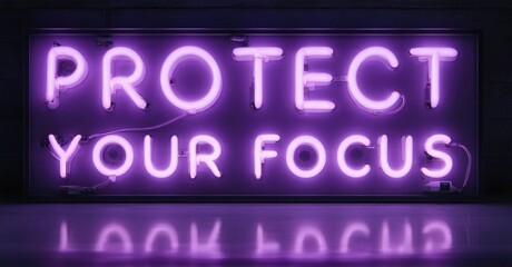 Fototapeta premium Bright purple neon sign displays motivational text. Dark background emphasizes glowing message, creating dramatic visual impact.