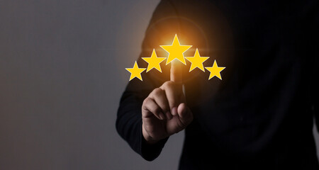Review Customer, Young Man hand touching five star to review and give 5 stars with very good results in service, Good review 5 star rating choice feedback