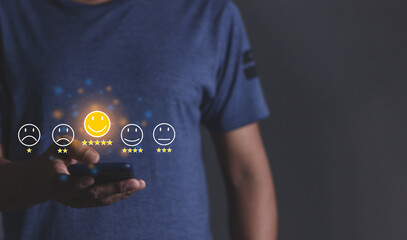 Customer Review, Young Man hand holding Smart Phone with five star to review and give 5 stars with very good results in service, Good review 5 star rating choice feedback