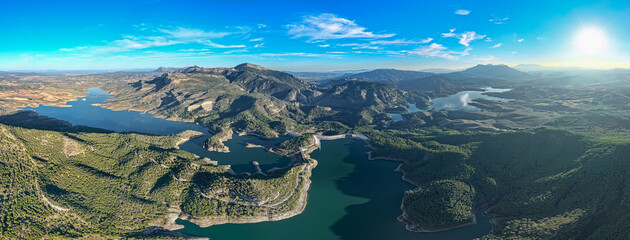 Cinematic Aerial 4K: Sweeping Wide-Angle Sunset Over Guadalhorce Lake, Pine Forests, and the Dramatic Caminito del Rey Gorge in Andalusia
