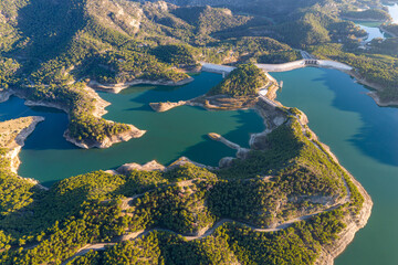 Cinematic Aerial 4K: Sweeping Wide-Angle Sunset Over Guadalhorce Lake, Pine Forests, and the Dramatic Caminito del Rey Gorge in Andalusia