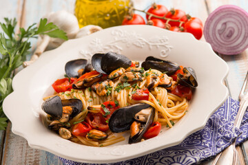 spaghetti with mussels tomatoes and parsley