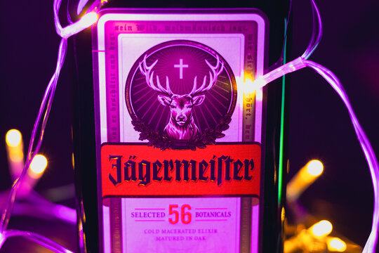 KYIV, UKRAINE - December 20, 2025 : Bottle of Jagermeister liquor drink in christmas lights and new year garlands.