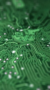 Animation electronic signal move and flash along surface tracks of green circuit board. Motherboard close up. Motion design, animated computer graphics of a computer or microchip. selective focus