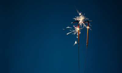 11 years celebration festive background with copy space made with Bengal fires in the form of number Eleven.