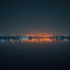 City Skyline Reflected in Calm Water at Night with Warm Orange and Blue Hues