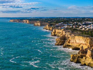 Epic Algarve Coastline: Aerial View of the "Seven Hanging Valleys" Hiking Trail Connecting the Iconic Rock Formations of Algar Seco and Praia da Marinha, Portugal