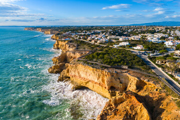 Algarve's Hidden Jewel: Cinematic Aerial View of Praia de Albandeira and its Iconic Sea Arch, Nestled Along the Rugged Coastal Hiking Trails of Portugal