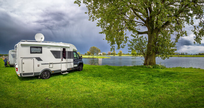 Recreational vehicle parking by the water in Maasbommel
