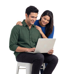 Smiling man and woman using a laptop together browsing online on white or transparent background.