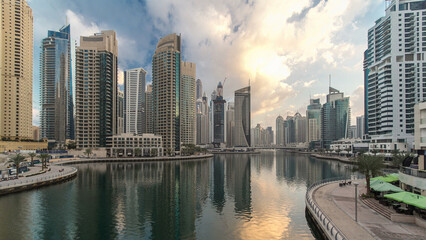 Fototapeta premium Dubai Marina towers and canal in Dubai night to day timelapse