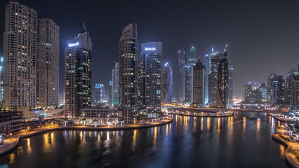 Obraz premium Beautiful aerial top view day to night transition timelapse of Dubai Marina canal
