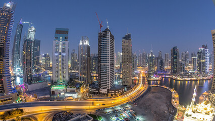 Beautiful aerial top view day to night transition timelapse of Dubai Marina canal