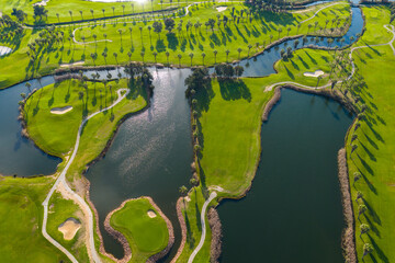The Ultimate Retirement Dream: Cinematic Aerial Flyover of Salgados Golf Course Nestled Between the Atlantic Ocean and Natural Lagoons in Algarve, Portugal