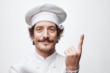 A cheerful chef with a distinguished mustache points upwards, offering culinary ideas.