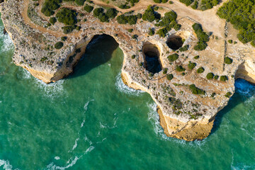 Algarve's Hidden Jewel: Cinematic Aerial View of Praia de Albandeira and its Iconic Sea Arch, Nestled Along the Rugged Coastal Hiking Trails of Portugal
