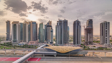 Obraz premium Aerial top view to Sheikh Zayed road during sunrise near Dubai Marina and JLT timelapse, Dubai.