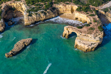 Algarve's Hidden Jewel: Cinematic Aerial View of Praia de Albandeira and its Iconic Sea Arch, Nestled Along the Rugged Coastal Hiking Trails of Portugal