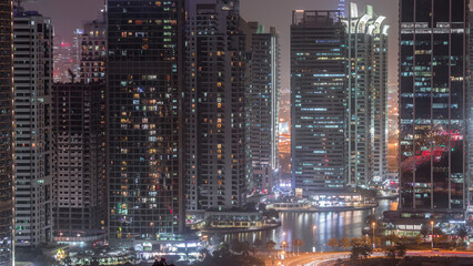 Naklejka premium Residential and office buildings in Jumeirah lake towers district day to night timelapse in Dubai