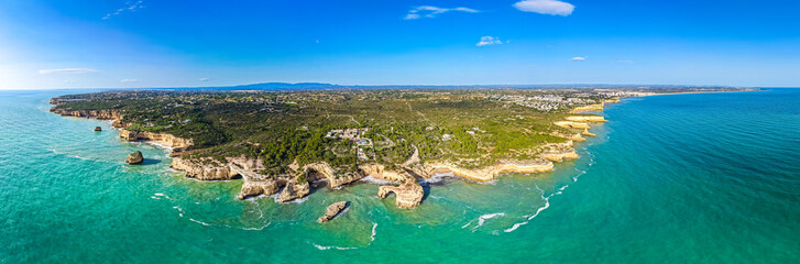 Algarve's Hidden Jewel: Cinematic Aerial View of Praia de Albandeira and its Iconic Sea Arch, Nestled Along the Rugged Coastal Hiking Trails of Portugal