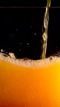 Pouring Fanta Cocktail With Orange Juice in Slow Motion at 1000 Fps Captured in 4K
