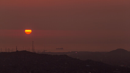 Aerial view of the Pacific ocean during sunset timelapse from Cerro San Cristobal, Lima