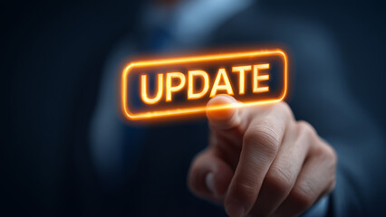 businessman interact with text "๊UPDATE"