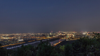 Skyline of Vienna from Danube Viewpoint Leopoldsberg aerial day to night timelapse.