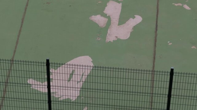 Aerial of Weathered Court Lines Suggesting Ghost and Dinosaur Shapes