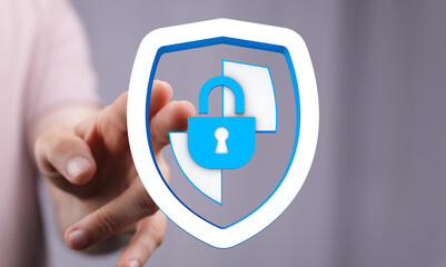 Hand touching digital shield with lock icon. Concept for cyber security protection and digital privacy. Data protection concept. Secu