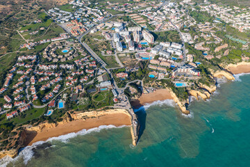 The Golden Coast: Aerial Cinematic 4K View of Luxury Villas, Resorts, and Real Estate at Alporchinhos Overlooking the Turquoise Waters of Praia de Albandeira, Algarve, Portugal
