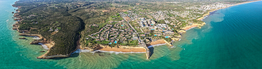 Algarve's Hidden Jewel: Cinematic Aerial View of Praia de Albandeira and its Iconic Sea Arch, Nestled Along the Rugged Coastal Hiking Trails of Portugal