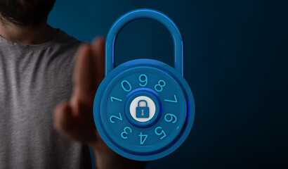 Concept of cybersecurity: a hand touching a padlock, representing protection and safeguarding online data and i