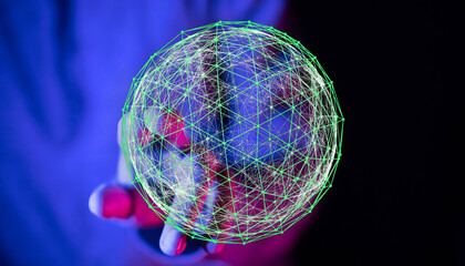 Close-up of a hand holding a glowing digital network sphere, representing global connection, technology, and futuristic concepts.