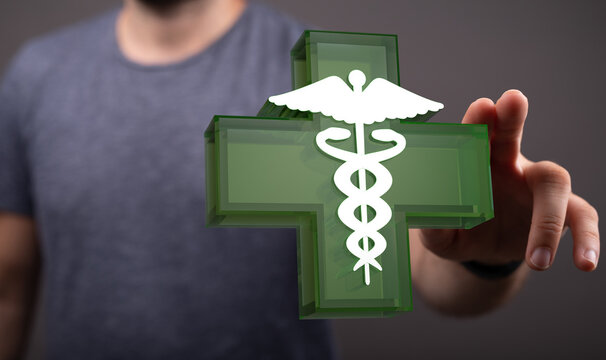Healthcare professional interacting with a Caduceus symbol. Represents medicine, medical help, and medical ass