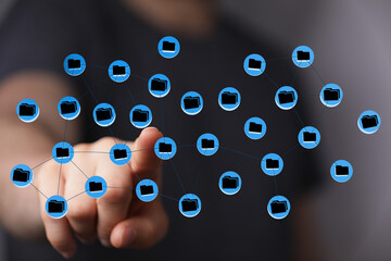 Hand interacting with a virtual network of cloud storage, data files and digital concepts. Communication concep