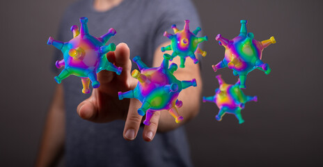 Obraz premium Abstract digitally rendered virus in rainbow colors, floating near a person's hand, representing concepts of h