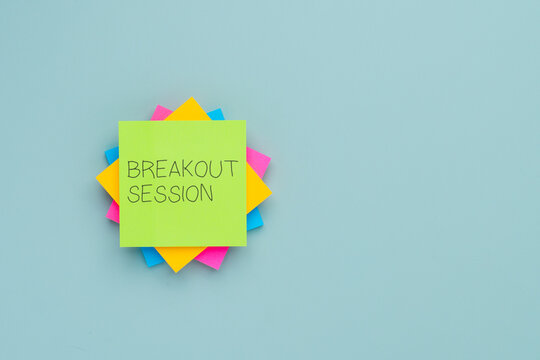 A stack of colorful sticky notes with text BREAKOUT SESSION. Meetings, conferences, workshops, brainstorming concept.
