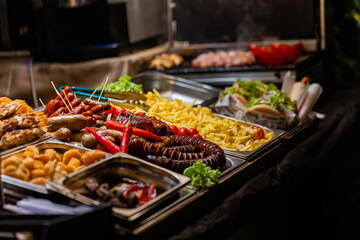 Traditional Christmas Market Street Food Selection with Grilled Sausages and Vegetables