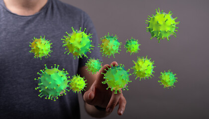 Conceptual image of a person touching and interacting with a digital representation of coronavirus particles a